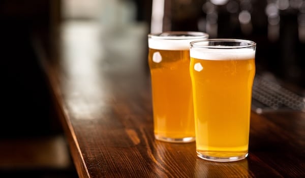 Pale ale vs IPA side by side comparison in two beer glasses